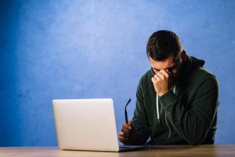 Suspicious man analyzing fake profiles