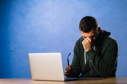 Suspicious man analyzing fake profiles